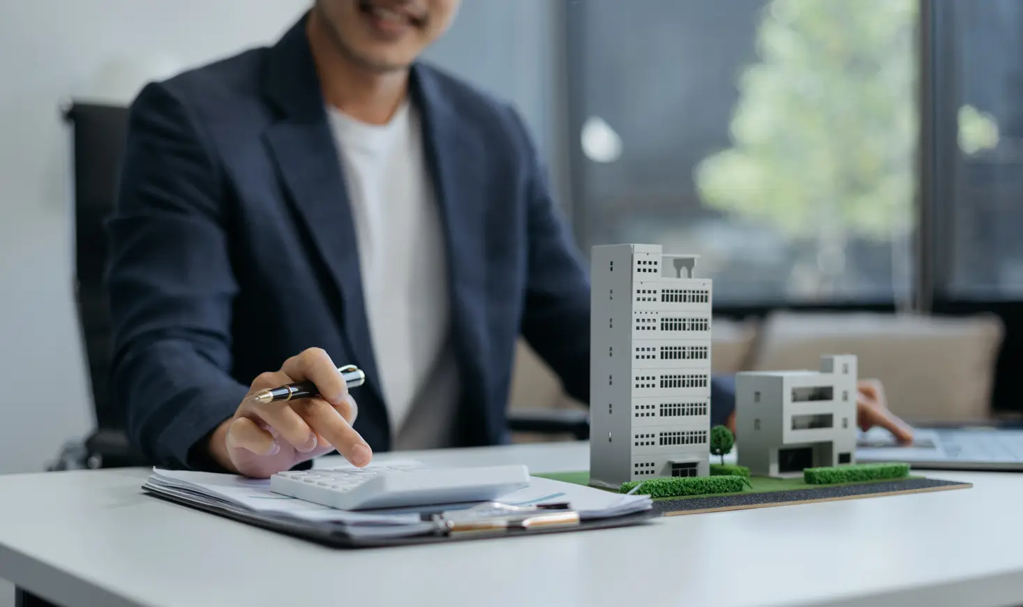 Technician reviewing the plan of a building