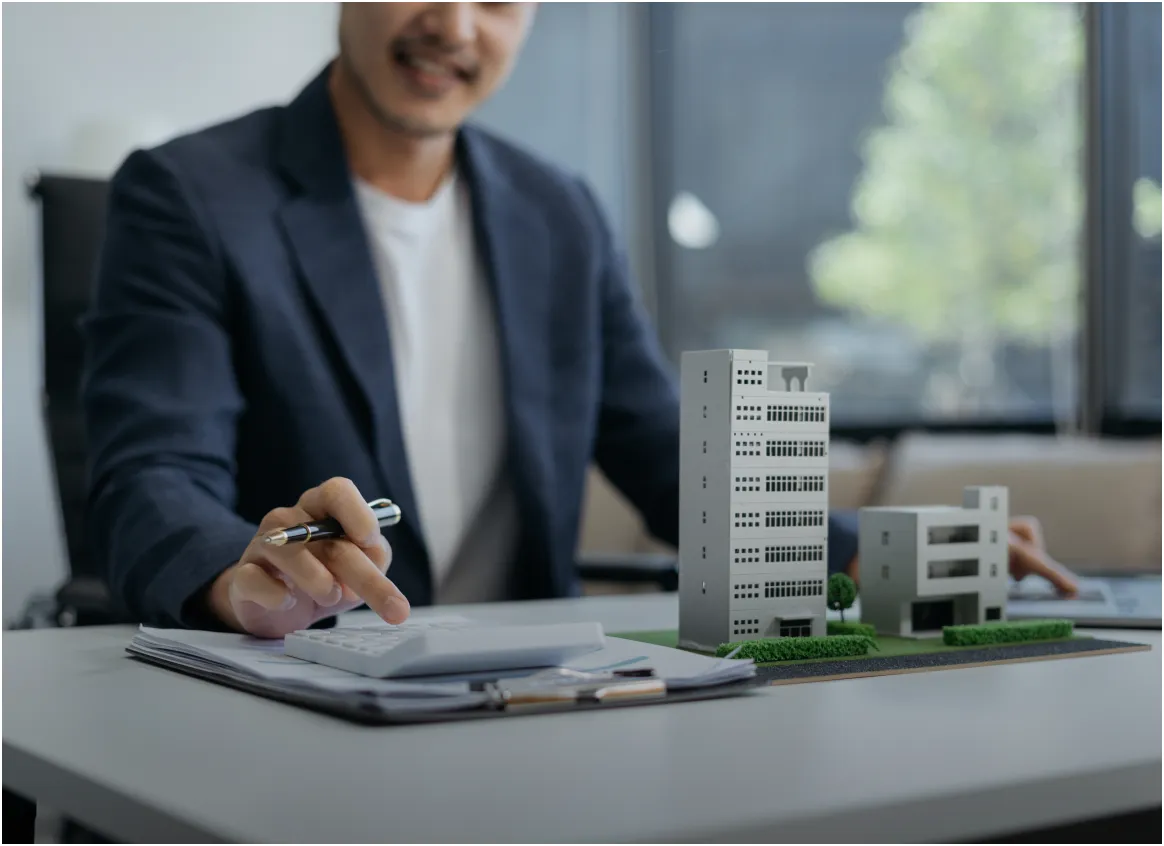 Technician working on the plan of a building