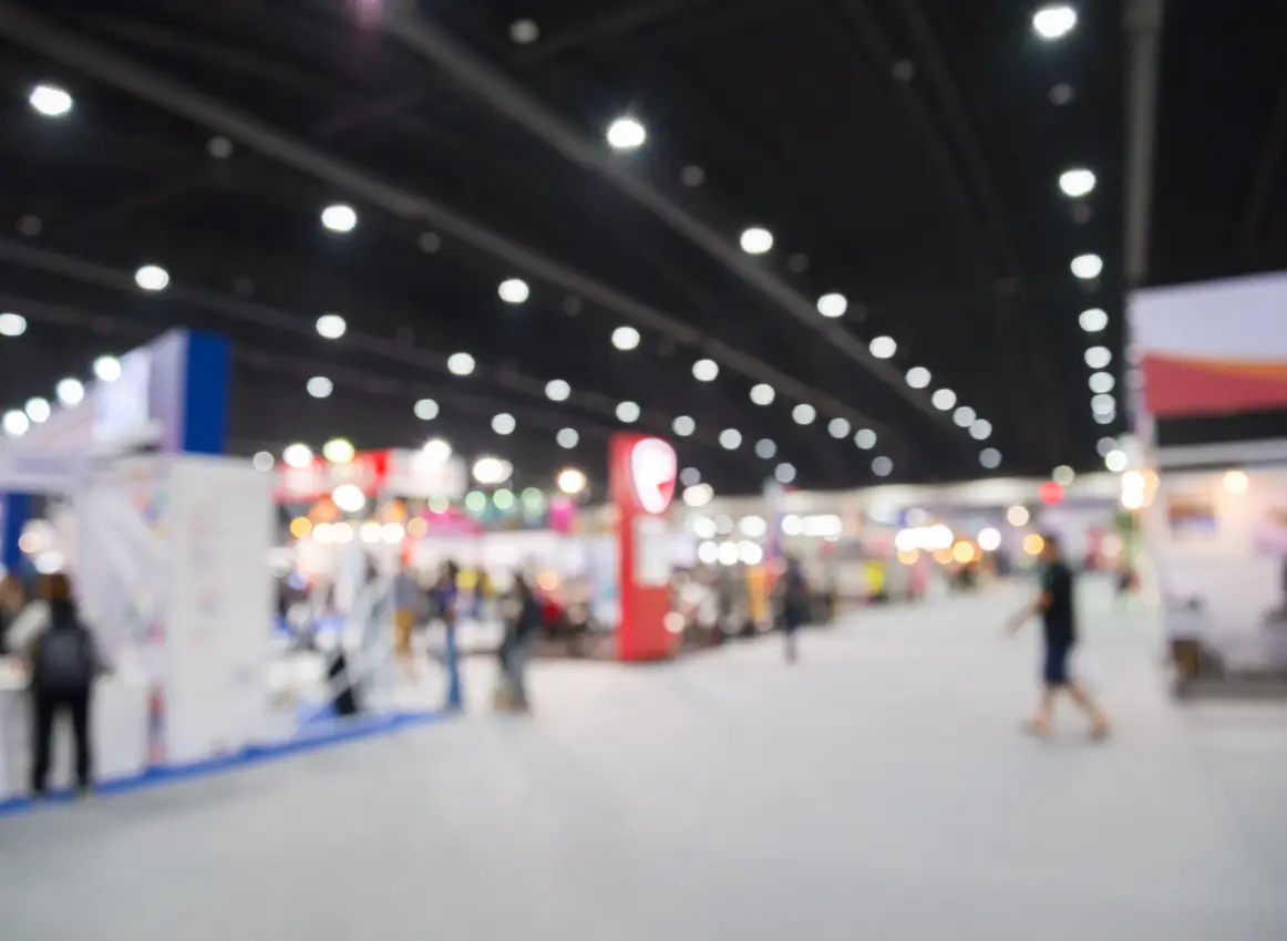 Visitors at a trade fair stand